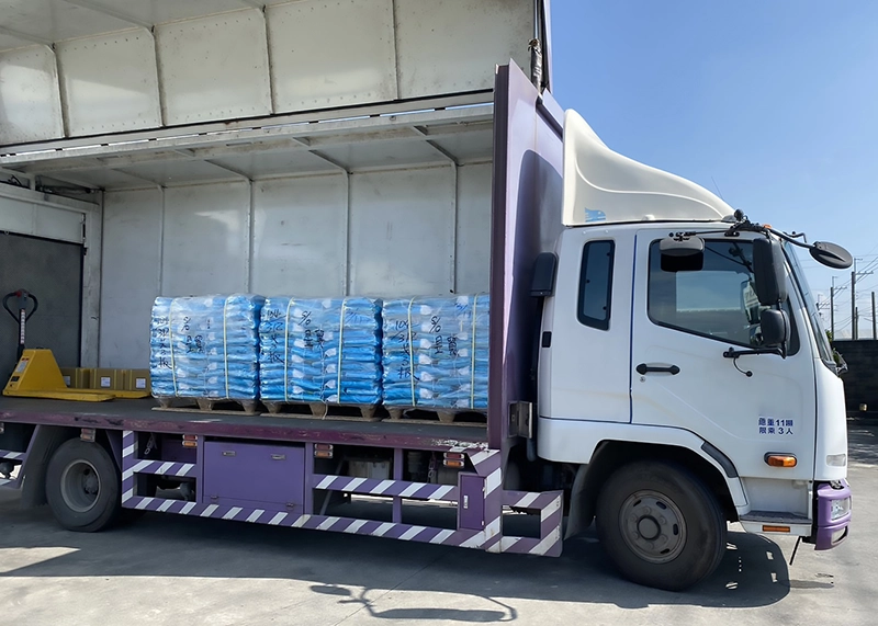 Aqua-Win water softener salt tablets loaded in a shipping container for bulk export and international delivery.